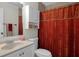 Bathroom featuring a white vanity, toilet, and a shower with a patterned curtain at 13923 Pathfinder Dr, Tampa, FL 33625