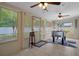 Sun-filled bonus room with large windows and a foosball table at 13923 Pathfinder Dr, Tampa, FL 33625