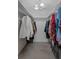 Spacious walk-in closet with clothing racks and ample storage for an organized wardrobe at 13923 Pathfinder Dr, Tampa, FL 33625