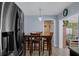 Charming dining area with a wooden table and chairs, adjacent to the kitchen at 13923 Pathfinder Dr, Tampa, FL 33625