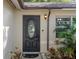Close-up of front door with decorative glass and sidelight at 13923 Pathfinder Dr, Tampa, FL 33625
