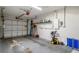 Well-lit garage with a visible garage door mechanism and storage equipment at 13923 Pathfinder Dr, Tampa, FL 33625