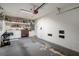 Bright garage with ample storage space, including shelving and a tool chest at 13923 Pathfinder Dr, Tampa, FL 33625