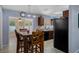 Well-equipped kitchen with dark wood cabinets and stainless steel appliances at 13923 Pathfinder Dr, Tampa, FL 33625