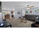 Spacious living room with wood floors, a ceiling fan, and bright, neutral paint at 13923 Pathfinder Dr, Tampa, FL 33625