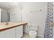 Well-lit bathroom featuring modern fixtures, vanity with storage, and a toilet at 13935 Coronado Dr, Spring Hill, FL 34609