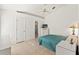 Comfortable bedroom with tile floors, a ceiling fan and bright natural light at 13935 Coronado Dr, Spring Hill, FL 34609