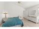 Cozy bedroom with tile floors, a ceiling fan and bright natural light at 13935 Coronado Dr, Spring Hill, FL 34609