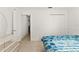 This bright bedroom boasts white walls, tile floors, and a double-door closet at 13935 Coronado Dr, Spring Hill, FL 34609