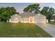 Charming single-story home with a well-maintained lawn and mature trees at 13935 Coronado Dr, Spring Hill, FL 34609