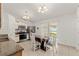 Eat-in kitchen features stainless steel appliances, white cabinets, and tile flooring at 13935 Coronado Dr, Spring Hill, FL 34609