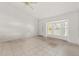 Inviting living room with a ceiling fan and a large bay window at 13935 Coronado Dr, Spring Hill, FL 34609
