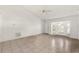 Inviting living room with a ceiling fan and a large bay window at 13935 Coronado Dr, Spring Hill, FL 34609