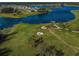 Scenic aerial view of the community park, walking trail, and lake at 14008 Lugano Ct, Hudson, FL 34669