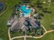 Aerial view of community pool and recreation center, highlighting the amenities at 14008 Lugano Ct, Hudson, FL 34669