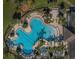 Aerial view of the community pool showcasing its unique clover shape at 14008 Lugano Ct, Hudson, FL 34669