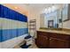 Second bathroom featuring granite countertops, decorative shelving, and tile flooring at 14008 Lugano Ct, Hudson, FL 34669