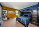 A colorful bedroom with a bunk bed features a view of the neighborhood pond at 14008 Lugano Ct, Hudson, FL 34669