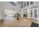Spacious clubhouse foyer with tile flooring, high ceilings, and elegant decor at 14008 Lugano Ct, Hudson, FL 34669