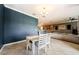 Bright dining room area with stylish chandelier, modern furniture, and elegant decor at 14008 Lugano Ct, Hudson, FL 34669