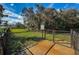 Dog park with a secure gate, fencing, and rules posted for a safe and enjoyable experience for dogs and their owners at 14008 Lugano Ct, Hudson, FL 34669