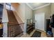 Inviting entryway with stairs, white door, tiled floor, a wooden shelving unit, and neutral paint at 14008 Lugano Ct, Hudson, FL 34669