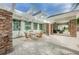 Exterior showcasing pool with pergolas, seating, and lush landscaping at 14008 Lugano Ct, Hudson, FL 34669