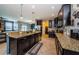 Large kitchen featuring granite countertops, stainless steel appliances, and adjacent breakfast nook at 14008 Lugano Ct, Hudson, FL 34669