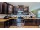 Updated kitchen with stainless steel appliances, granite countertops, and ample cabinet space at 14008 Lugano Ct, Hudson, FL 34669