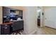 Cozy office space with a built-in desk and shelving, perfect for remote work or study at 14008 Lugano Ct, Hudson, FL 34669