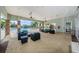 Inviting poolside lounge area with comfortable seating and ceiling fans at 14008 Lugano Ct, Hudson, FL 34669