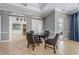 Seating area featuring a circular table with four chairs and views from exit doors and windows at 14008 Lugano Ct, Hudson, FL 34669