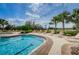 Swimming pool with clear blue water and comfortable lounge seating at 14008 Lugano Ct, Hudson, FL 34669