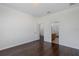 Bright bedroom featuring hardwood floors and a glimpse of the adjoining bathroom at 15159 Durango Cir, Brooksville, FL 34604