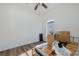 Bright bedroom featuring hardwood floors and a ceiling fan at 15159 Durango Cir, Brooksville, FL 34604