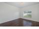 Bedroom with hardwood floors, detailed wall, and bright lighting at 15159 Durango Cir, Brooksville, FL 34604