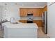Modern kitchen featuring stone countertops and stainless steel appliances at 15159 Durango Cir, Brooksville, FL 34604