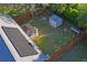 Aerial view of home showcasing large backyard with shed, patio, and fenced yard at 15613 Charmwood Dr, Hudson, FL 34667
