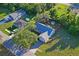 Aerial view of a home showcasing large lot, fenced yard, and mature trees at 15613 Charmwood Dr, Hudson, FL 34667