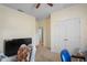 Bedroom featuring neutral walls, a ceiling fan, and comfortable seating arrangements at 15613 Charmwood Dr, Hudson, FL 34667