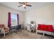 Bright bedroom featuring a ceiling fan, ample natural light, and comfortable furniture at 15613 Charmwood Dr, Hudson, FL 34667