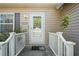 Inviting front entrance with a decorative glass door, sidelights, and a well-maintained porch at 15613 Charmwood Dr, Hudson, FL 34667