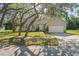 Charming single-Gathering home featuring a well-manicured lawn and an attached two-car garage at 15613 Charmwood Dr, Hudson, FL 34667
