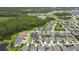 Aerial view of neighborhood featuring lake views at 16697 Courtyard Loop, Land O Lakes, FL 34638