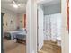 A bedroom and a bathroom are visible from a doorway, offering a convenient en-suite arrangement at 16697 Courtyard Loop, Land O Lakes, FL 34638