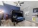 This bedroom features a bed with desk and storage at 16697 Courtyard Loop, Land O Lakes, FL 34638
