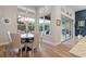 Charming dining area with a round table, stylish chairs, and bright natural light at 16697 Courtyard Loop, Land O Lakes, FL 34638