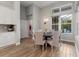 Cozy dining area with stylish lighting and a view of the pool and outdoor area at 16697 Courtyard Loop, Land O Lakes, FL 34638