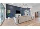 Open-concept living room with modern design, fireplace and abundant natural light at 16697 Courtyard Loop, Land O Lakes, FL 34638