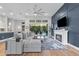 Cozy living room with stylish decor, fireplace and sliding glass doors to backyard at 16697 Courtyard Loop, Land O Lakes, FL 34638